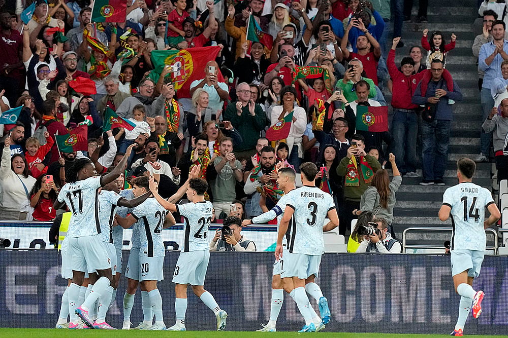 Portugal vs Croatia - Portugal players celebrate after Diogo Dalot scored the opening goal