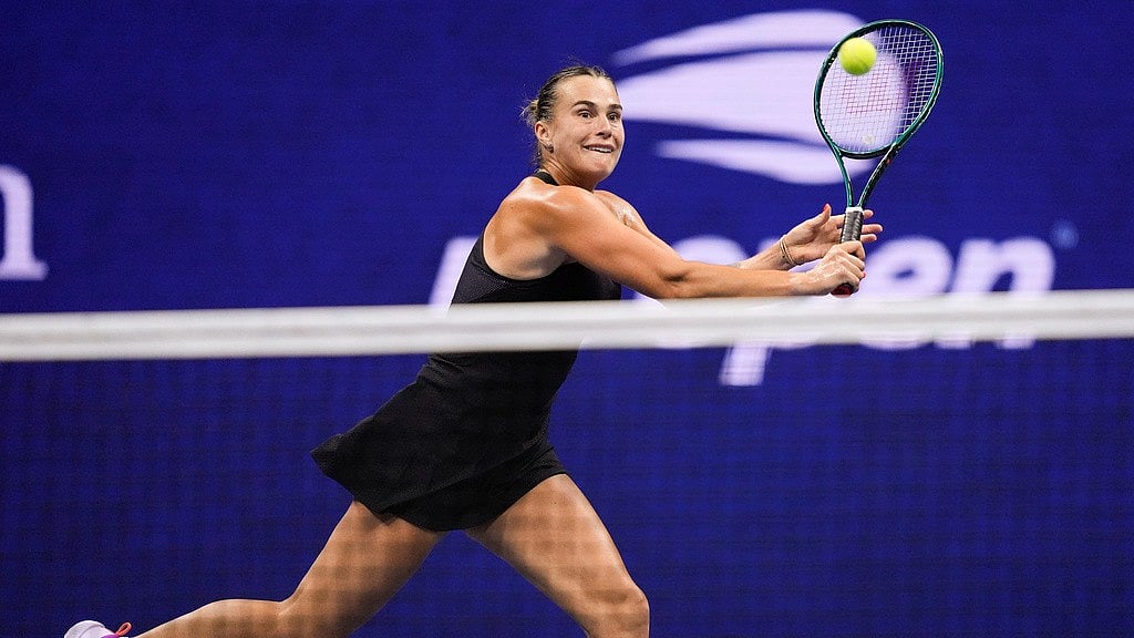 AP/Julia Nikhinson : Aryna Sabalenka returns to Emma Navarro during their women's singles semi-final match at US Open 2024 on Friday (September 6).