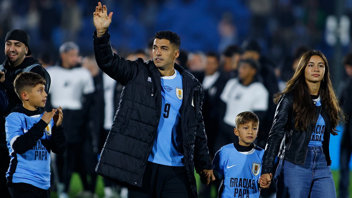 Luis Suarez pictured with his children after Friday's game