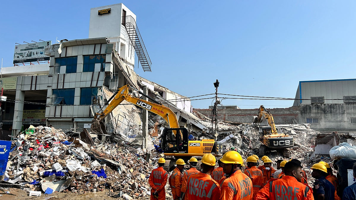 PTI : Relief work after building collapse in Lucknow.