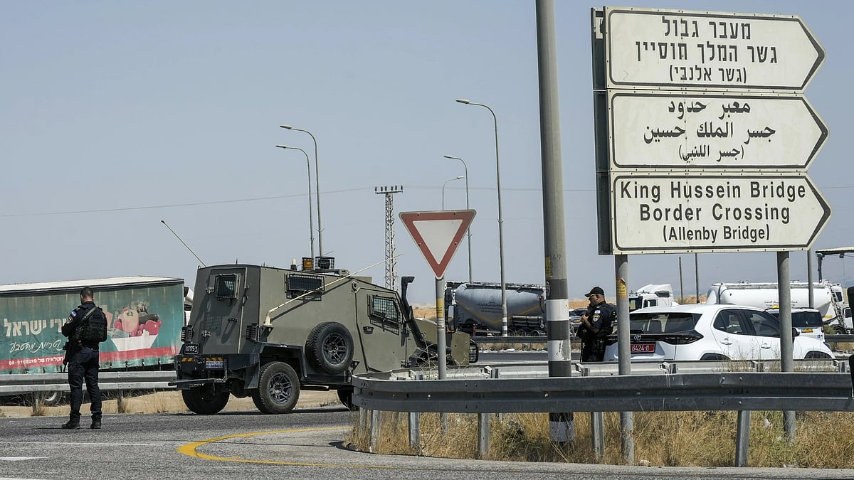 Israeli police stand guard near the site of deadly attack on security guards. - AP