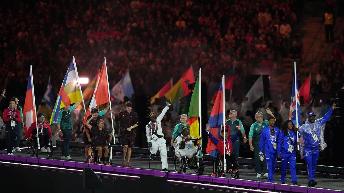 Athletes from different delegations parade. AP Photo