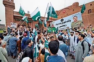Photo: Getty Images : Show of Support: People at a rally in solidarity with Pakistan’s army in Peshawar in May 2023 after military installations were allegedly damaged by supporters of former Prime Minister Imran Khan following his arrest