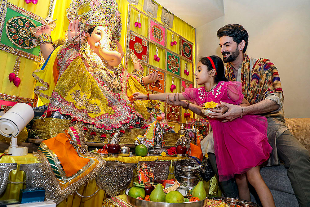 Bollywood actor Neil Nitin Mukesh with his daughter Nurvi during Ganesh Chaturthi festival