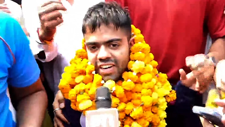 Paris Paralympics gold medallist Navdeep Singh speaks to the media after his arrival at the New Delhi airport. - PTI
