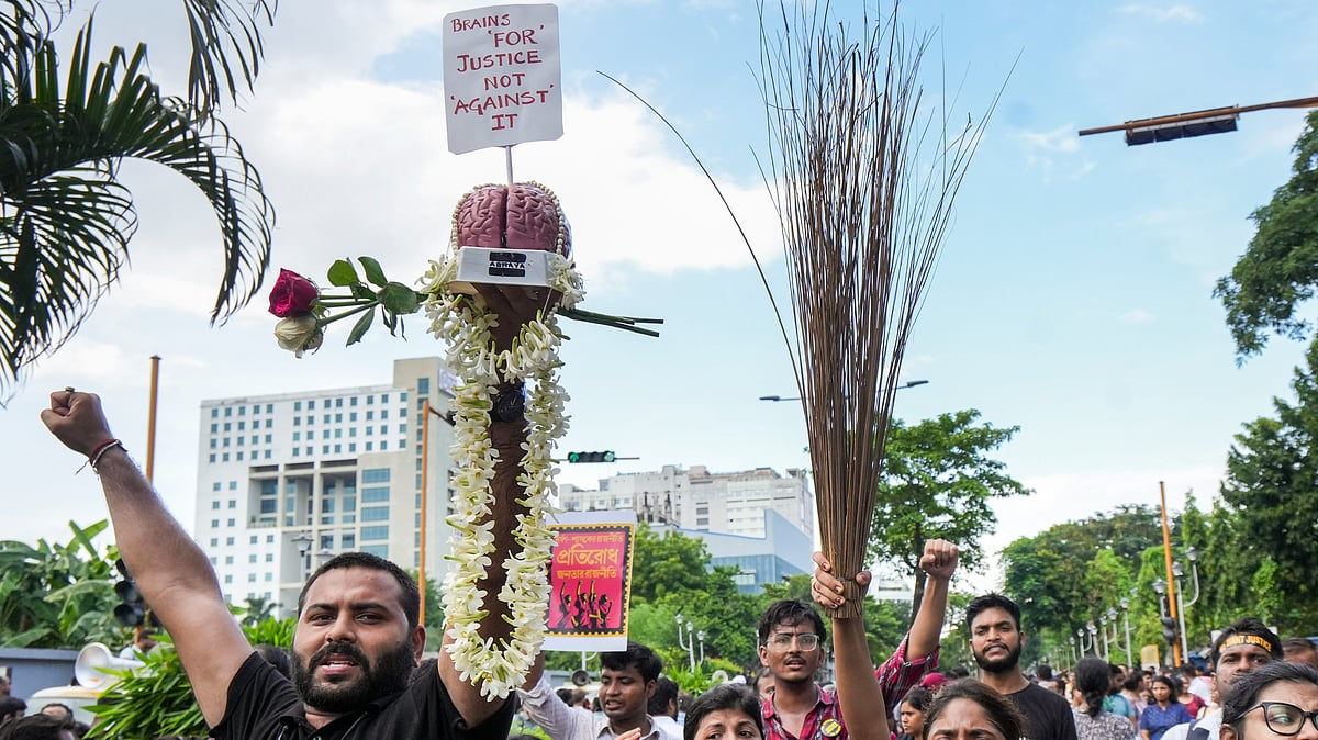 PTI : Junior doctors holding broom shout slogans as they march towards Swasthya Bhawan.