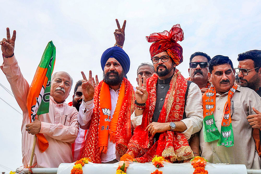 Anurag Thakur with BJP candidate Narinder Singh Raina during Nomination filing for J&K polls