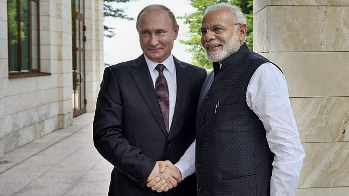 Prime Minister Narendra Modi (R) with Russian President Vladimir Putin (L) - PTI