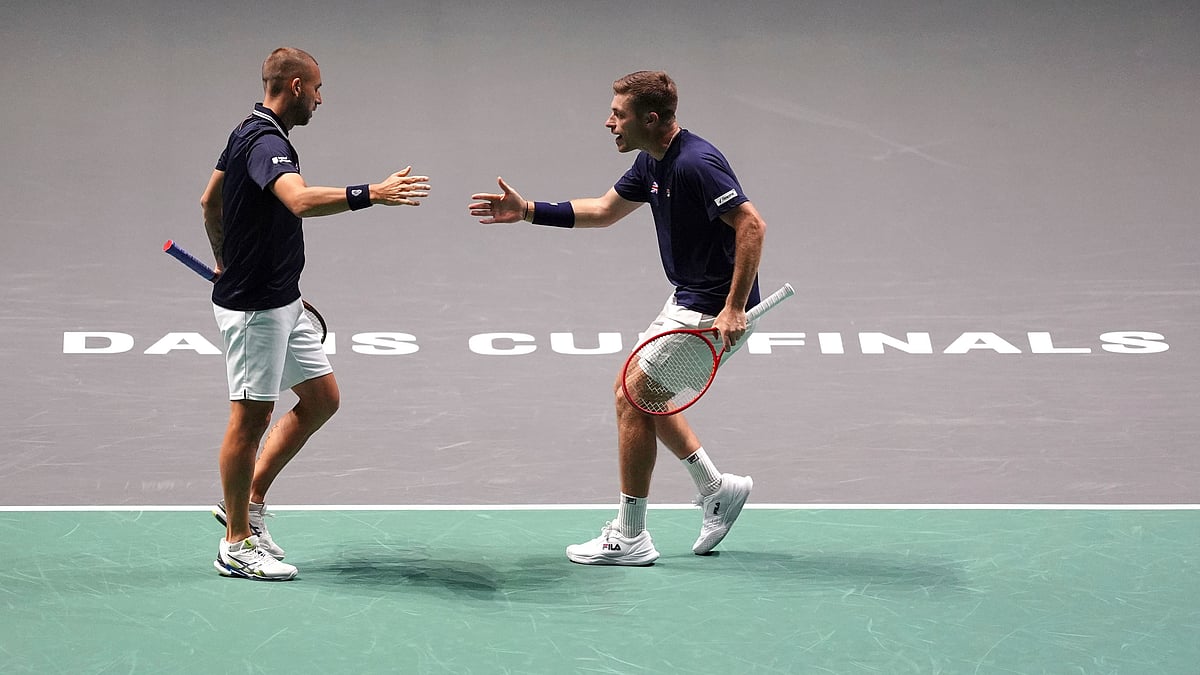 (Martin Rickett/PA via AP)

 : Great Britain's Dan Evans and Neal Skupski celebrate a point during the Davis Cup group stage finals match against Finland's Harri Heliovaara and Otto Virtanen at the AO Arena, in Manchester, England, Wednesday, Sept. 11, 2024. 
