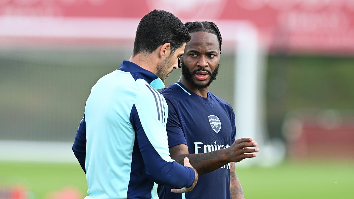 Mikel Arteta and Raheem Sterling during Arsenal training.