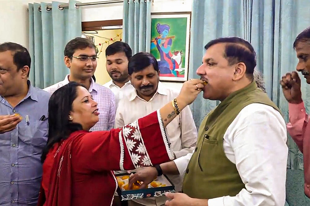 AAP leader Sanjay Singh celebrates with wife Anita Singh celebrates Kejriwals bail