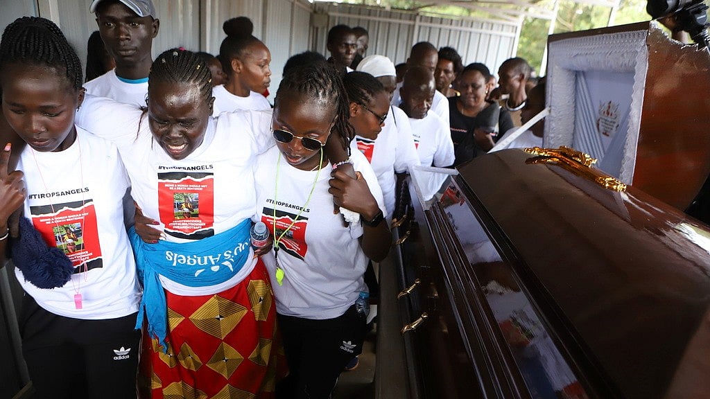 AP/Andrew Kasuku : Relatives try to comfort a woman crying after viewing the body of Ugandan Olympic athlete Rebecca Cheptegei at Moi Teaching and Referral Hospital morgue in Kenya on Friday (September 13, 2024).