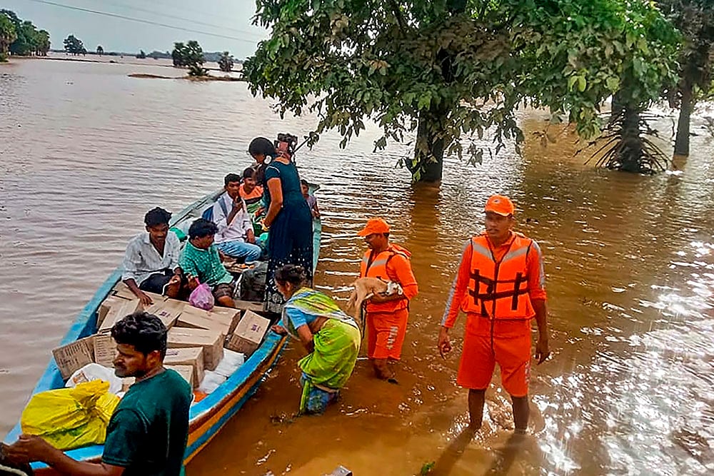 NDRF personnel evacuate people from Flood hit area in Andhra Pradesh