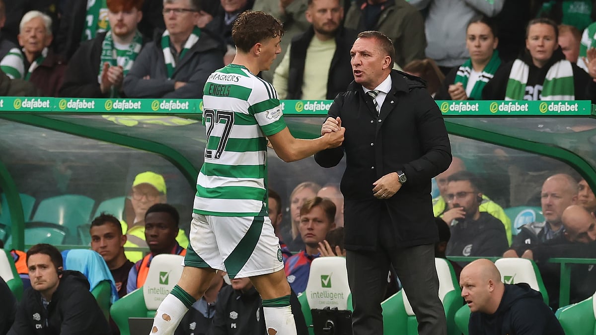 Arne Engels and Brendan Rodgers shake hands after the Belgian is substituted during the win against Hearts.