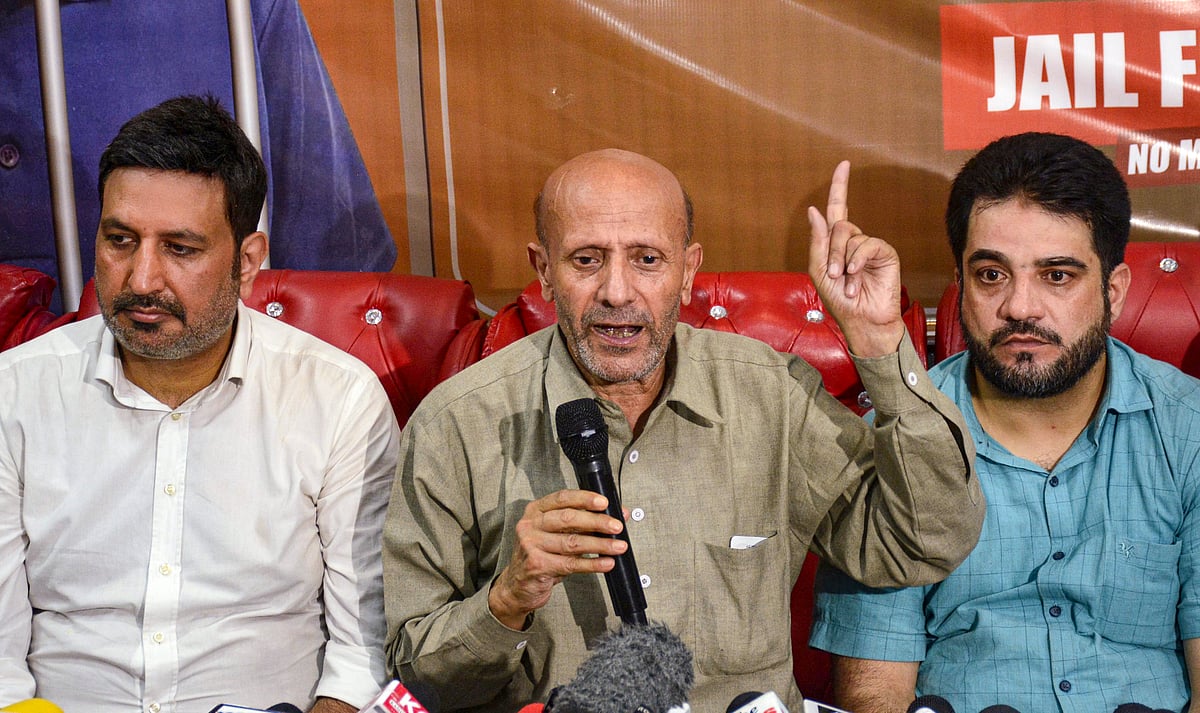PTI : Member Parliament and Awami Ittehad Party (AIP) chief Sheikh Abdul Rashid (in middle), popularly known as Engineer Rashid, addresses a press conference ahead of the Jammu and Kashmir Assembly elections, in Srinagar.