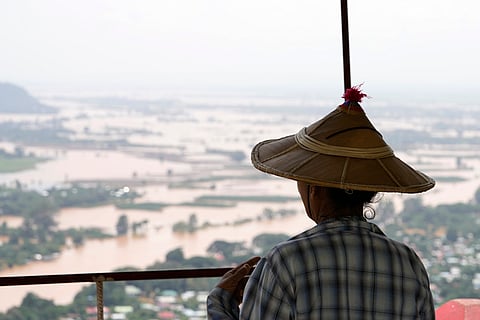 Myanmar floods: A woman looks out at flooded areas