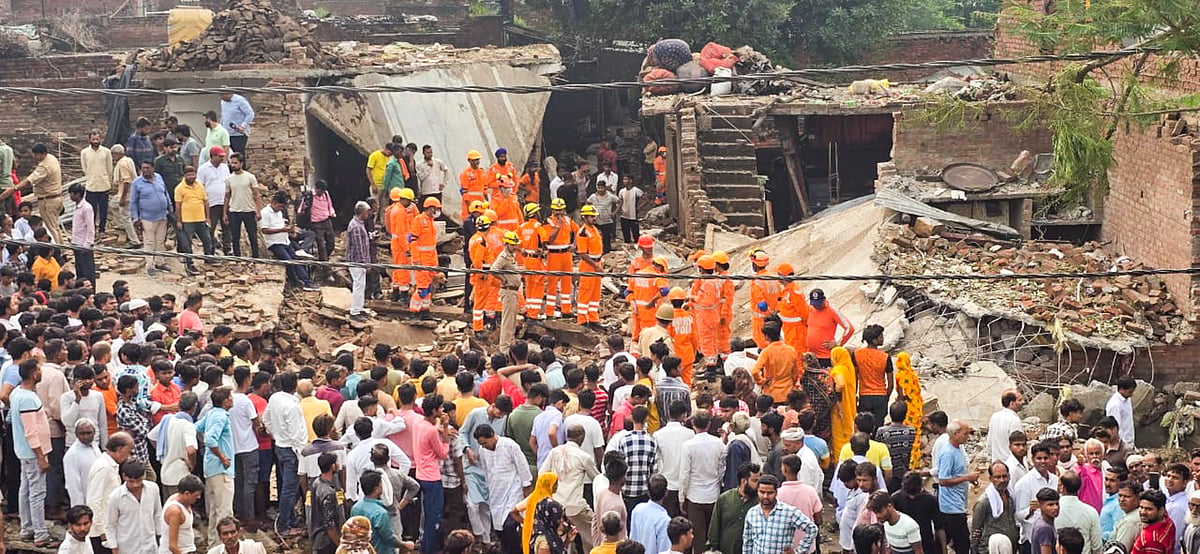 PTI : Rescue operation underway after an explosion at a firecracker factory, in Firozabad.
