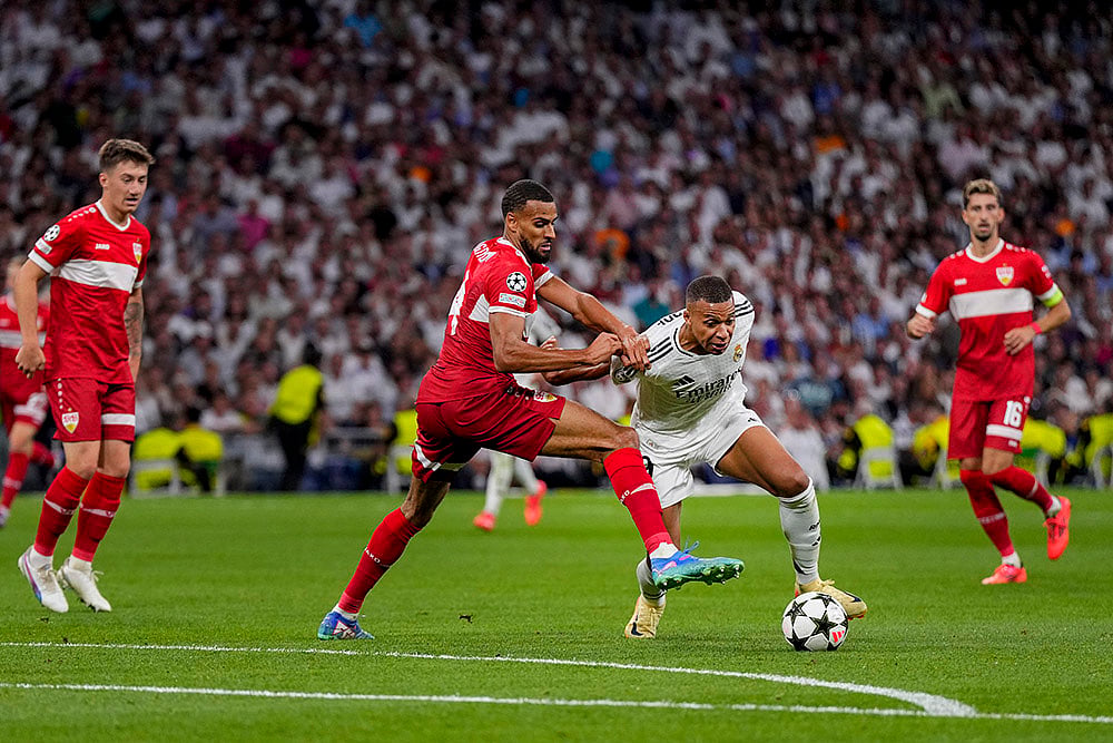| Photo: AP/Manu Fernandez : Champions League 2024-25, Real Madrid vs VfB Stuttgart: Real Madrid's Kylian Mbappe, right, vies for the ball with Stuttgart's Josha Vagnoman