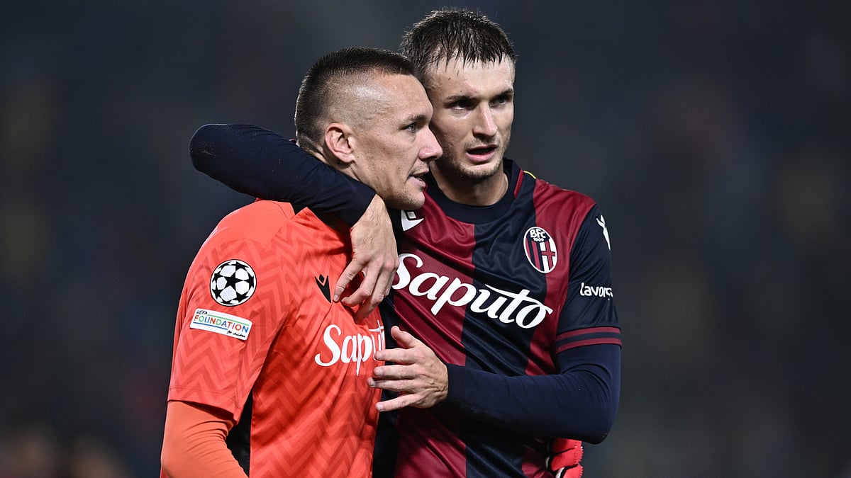 Lukasz Skorupski celebrates his penalty save