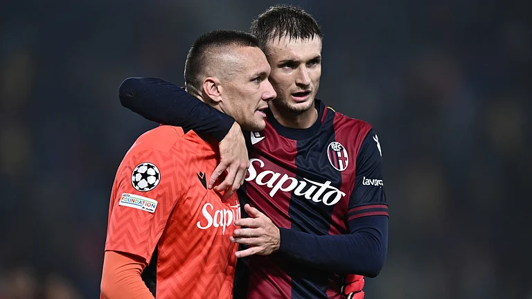 Lukasz Skorupski celebrates his penalty save - null