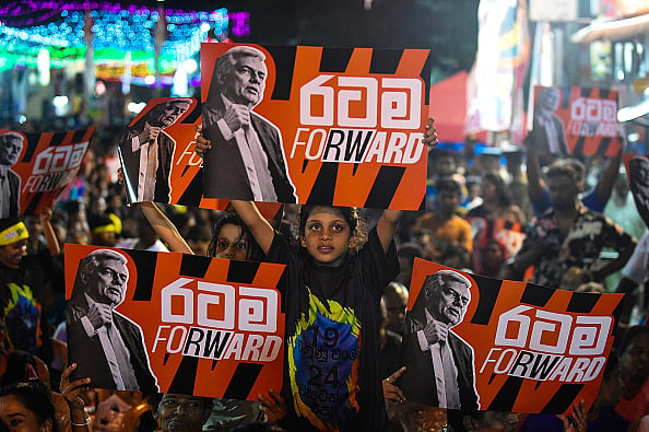 Getty Images : Supporters of Sri Lanka's president and independent presidential candidate Ranil Wickremesinghe attend an election rally ahead of the upcoming presidential elections in Colombo