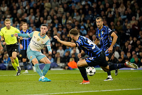 UEFA Champions League, Manchester City vs Inter Milan: Manchester City's Phil Foden, left, attempts a shot at goal