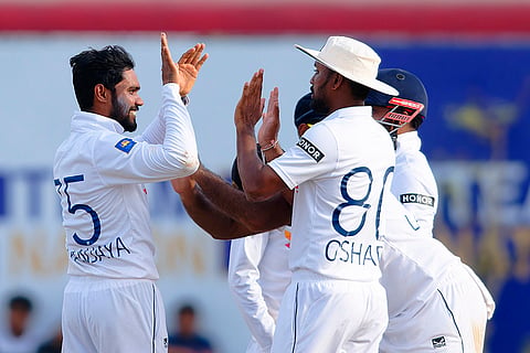 SL Vs NZ, 1st Test Day 2: Sri Lanka's captain Dhananjaya de Silva, left, celebrates the wicket of New Zealand's Rachin Ravindra