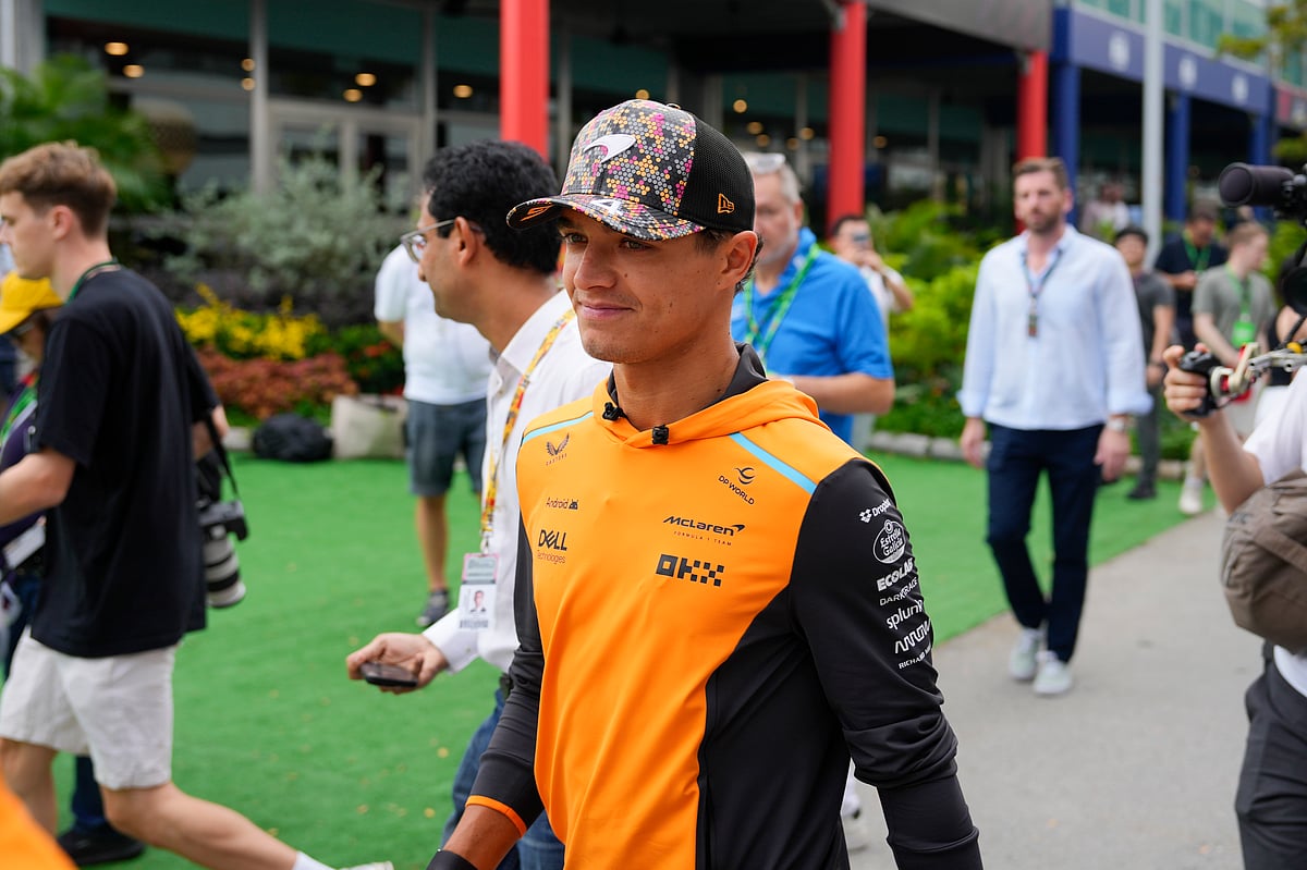 (AP Photo/Vincent Thian) : McLaren driver Lando Norris of Britain arrives during the first practice session of the Singapore Formula One Grand Prix at the Marina Bay Street Circuit, in Singapore, Friday, Sept. 20, 2024. 