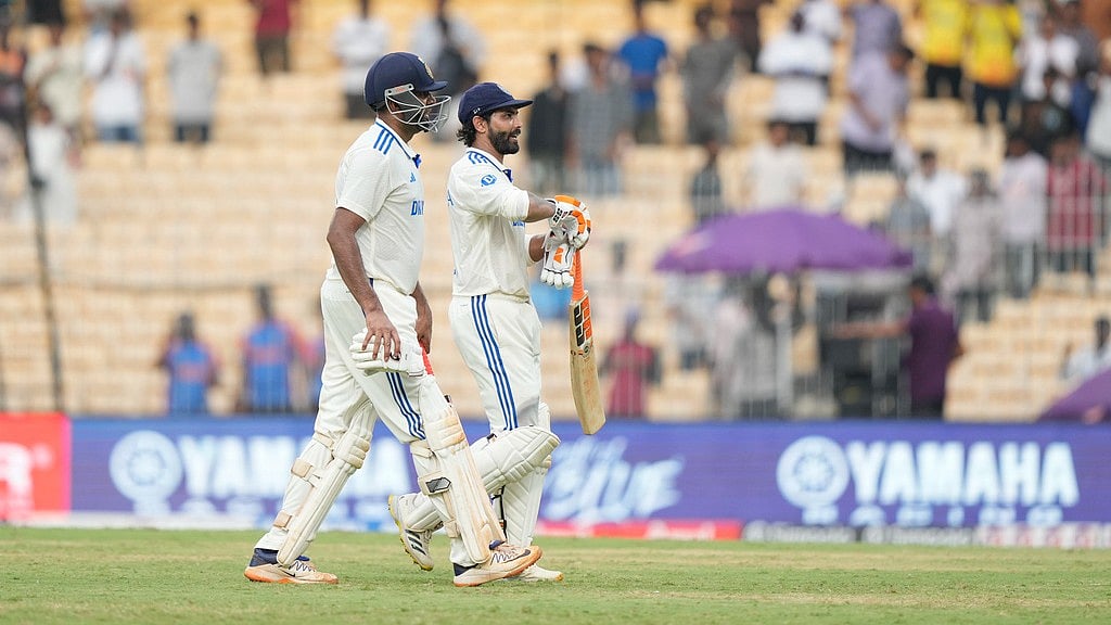 India's Ravichandran Ashwin, left, and Ravindra Jadeja leave the field at the end of the first day of the first cricket Test match. - AP/Mahesh Kumar A.