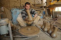 Tumbhaknari: The Soulful Rhythm Of Kashmir’s Heartbeat (Photo via Getty Images) : A potter works on an earthen Tumbaknari, a goblet drum traditional to Jammu and Kashmir, at a workshop on April 25, 2018 in Srinagar, India.