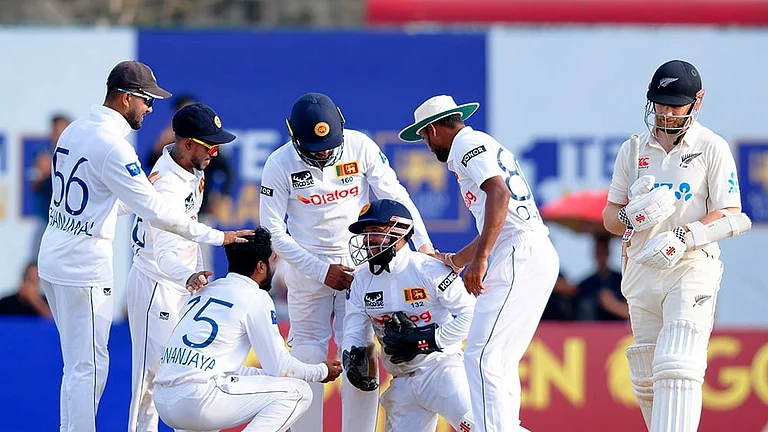 SL Vs NZ, 1st Test Sri Lanka's wicketkeeper Kusal Mendis is congratulated by teammates for taking the catch to get New Zealand's Kane Williamson, right, out. - | Photo: AP/Viraj Kothalawala
