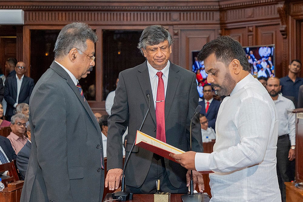 | Photo: Sri Lankan President's Office via AP : Sri Lanka elections result 2024: Marxist leader Anura Kumara Dissanayake, right, is sworn in as Sri Lanka's tenth president