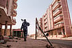 A Never-Ending War: Sudan's Humanitarian Crisis via Getty : An armed policeman walk in the area of the Souk, in the city of Omdurman, Sudan, on June 15, 2024.