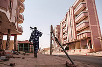 A Never-Ending War: Sudan's Humanitarian Crisis via Getty : An armed policeman walk in the area of the Souk, in the city of Omdurman, Sudan, on June 15, 2024.
