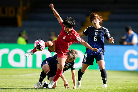 U-20 Women's World Cup, North Korean vs Japan: North Korea's Sin Hyang, left, and Japan's Hiromi Yoneda battle for the ball