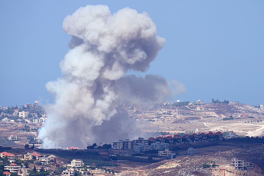 Photo: AP/Hussein Malla : Israel Lebanon