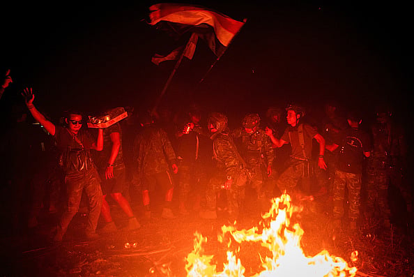 via Getty Images : Members of Karenni Resistance Force celebrate mission accomplishment in their base, in Shadaw Township.