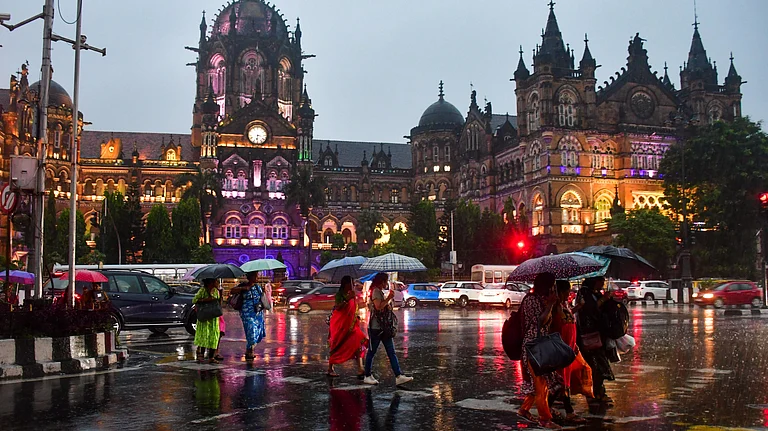 Pedestrians cross a road amid rain, in Mumbai, Wednesday, Sept. 25, 2024. - PTI