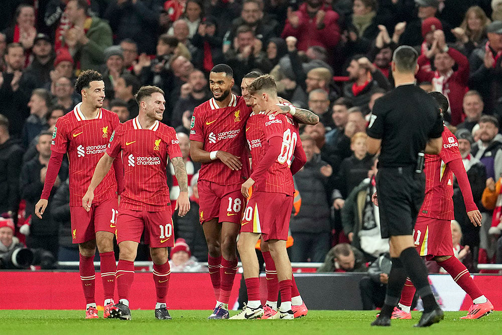 | Photo: AP/Jon Super : EFL Cup, Liverpool vs West Ham: Liverpool's Cody Gakpo, 3rd left, celebrates after scoring his side's fifth goal 