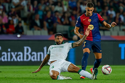La Liga 2024-25, Barcelona vs Getafe: Barcelona's Ferran Torres, right, duels for the ball with Getafe's Omar Alderete