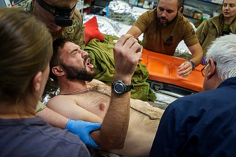 Russia Ukraine War: Ukrainian military medics of the Azov brigade move an injured comrade near Toretsk