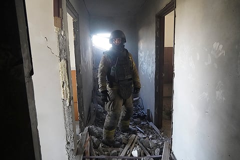 Russia Ukraine War: A soldier stands amidst the rubble and debris in Kharkiv