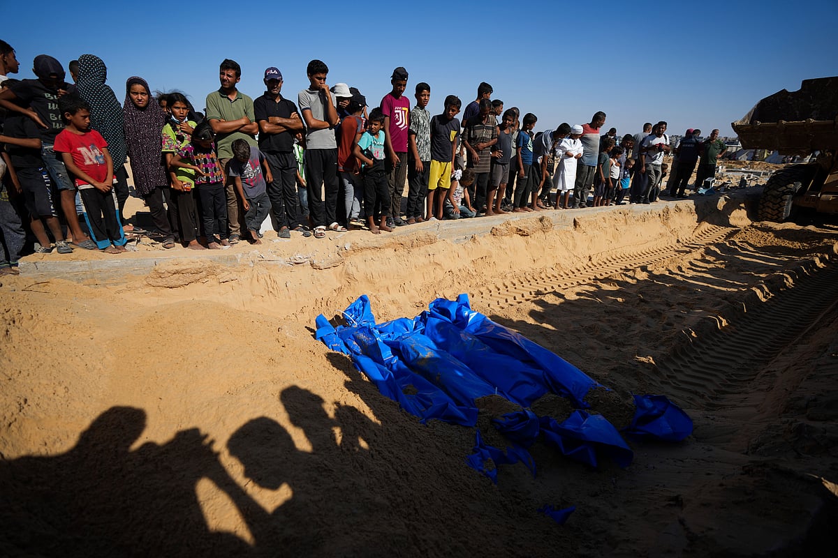 AP  : People bury the bodies of Palestinians taken by the Israeli military during operations in Gaza and returned this week, in Khan Younis, Gaza Strip, Thursday, Sept. 26, 2024.  / for representative purposes only