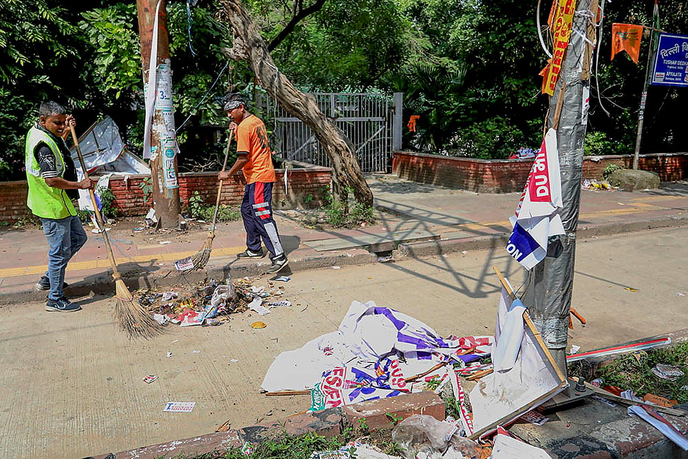 DUSU polls: Workers clear banners and posters after DUSU polls 2024