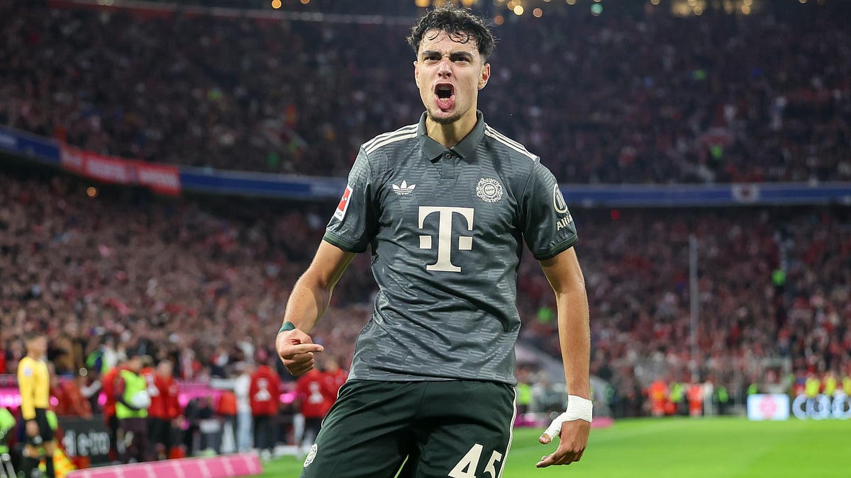 Aleksandar Pavlovic celebrates scoring the equaliser for Bayern Munich against Bayer Leverkusen - null