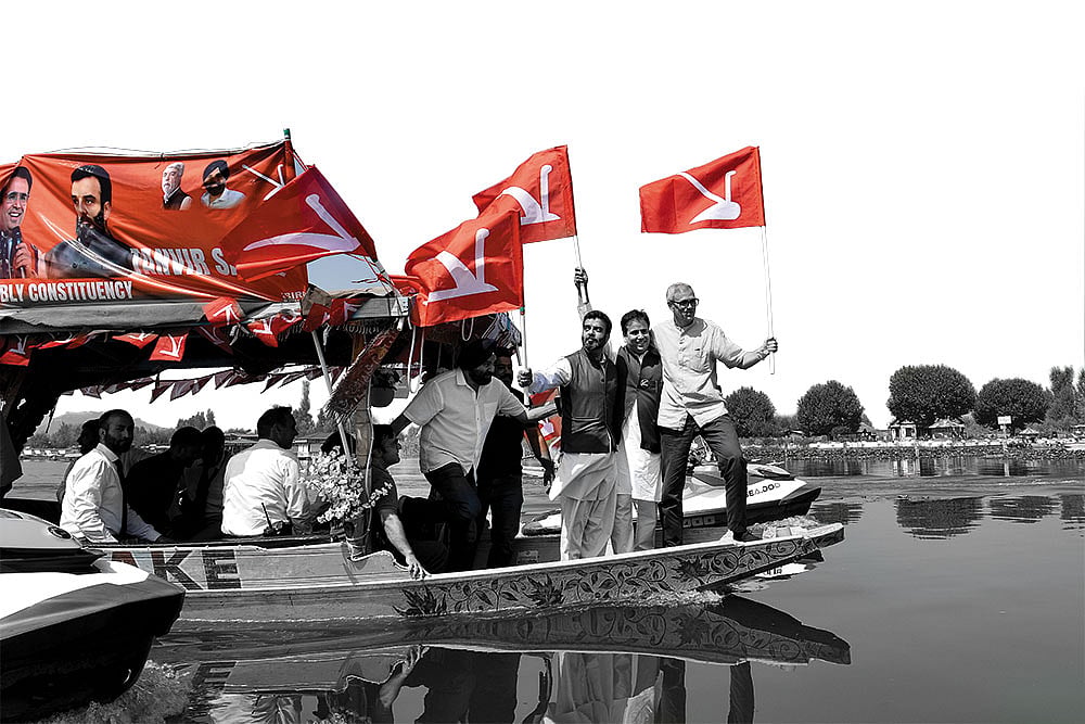 Photo: Yasir Iqbal : Smooth Sailing or Sinking?: Omar Abdullah with his party members during a boat rally in Srinagar