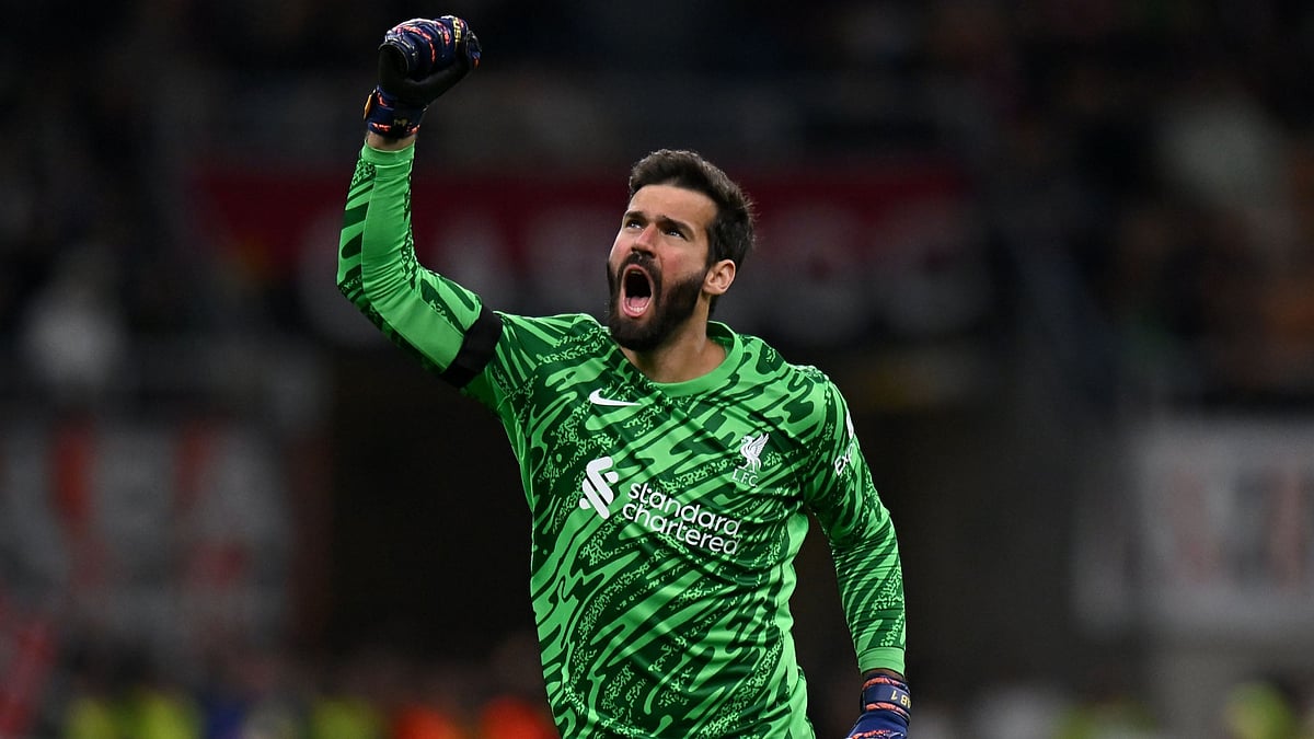 Alisson celebrating