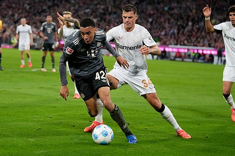 Bundesliga, Bayern Munich vs Leverkusen: Bayern's Jamal Musiala, left, and Leverkusen's Granit Xhaka vie for the ball 