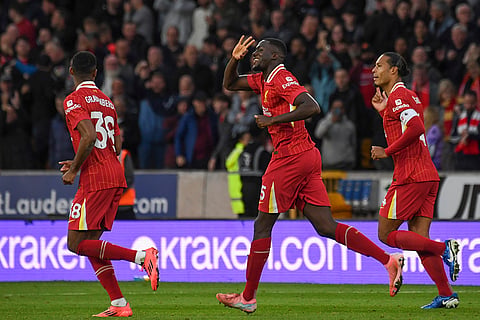 English Premier League 2024-25, Wanderers vs Liverpool: Liverpool's Ibrahima Konate, center, celebrates scoring his side's opening goal