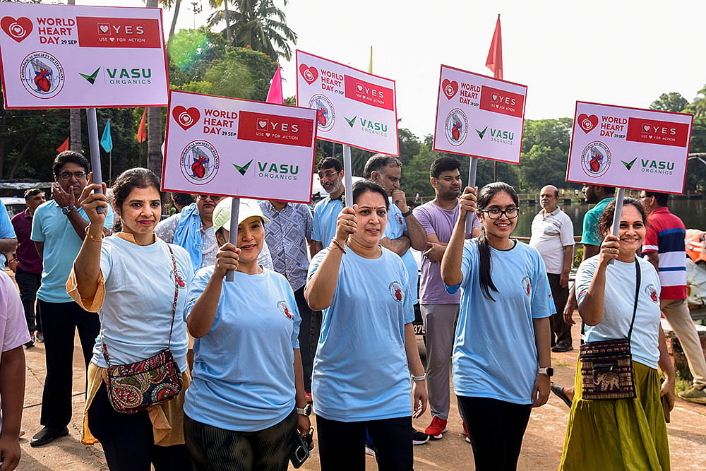 People take part in a 3km walk on World Heart Day